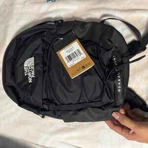 The North Face Black Backpack with Multiple Compartments and Comfortable Straps